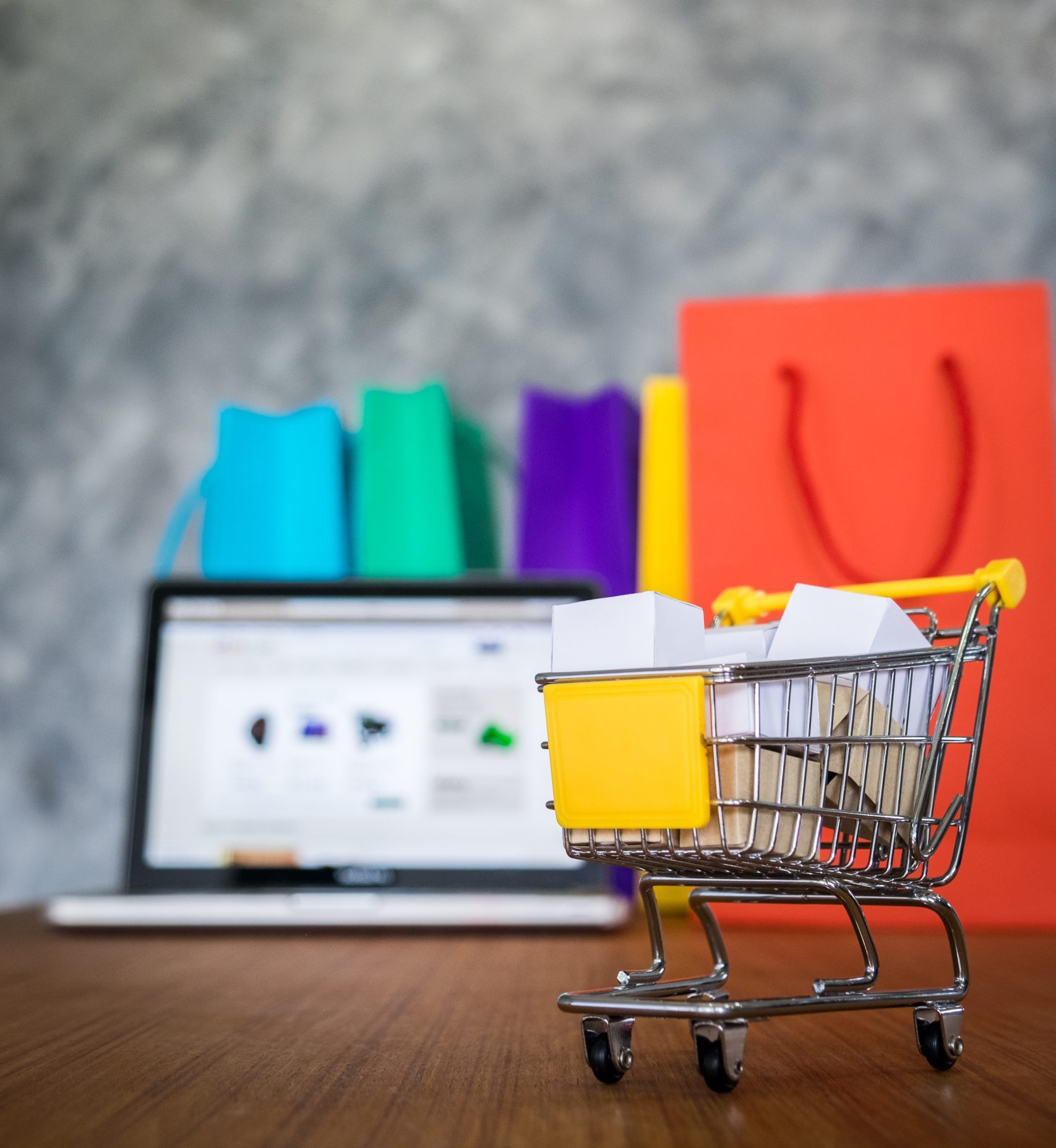 laptop and shopping bags, online shopping concept